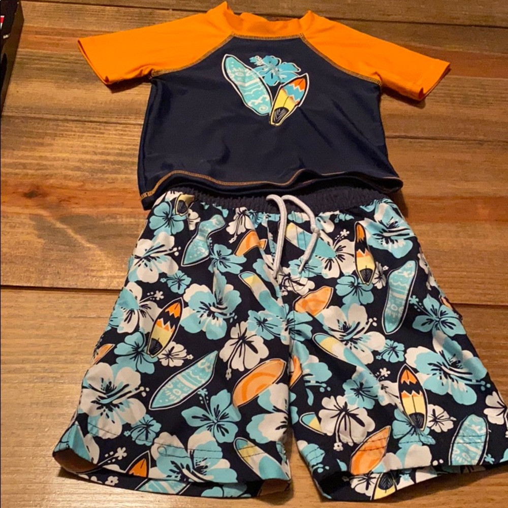Matching boys rash guard and swim trunks